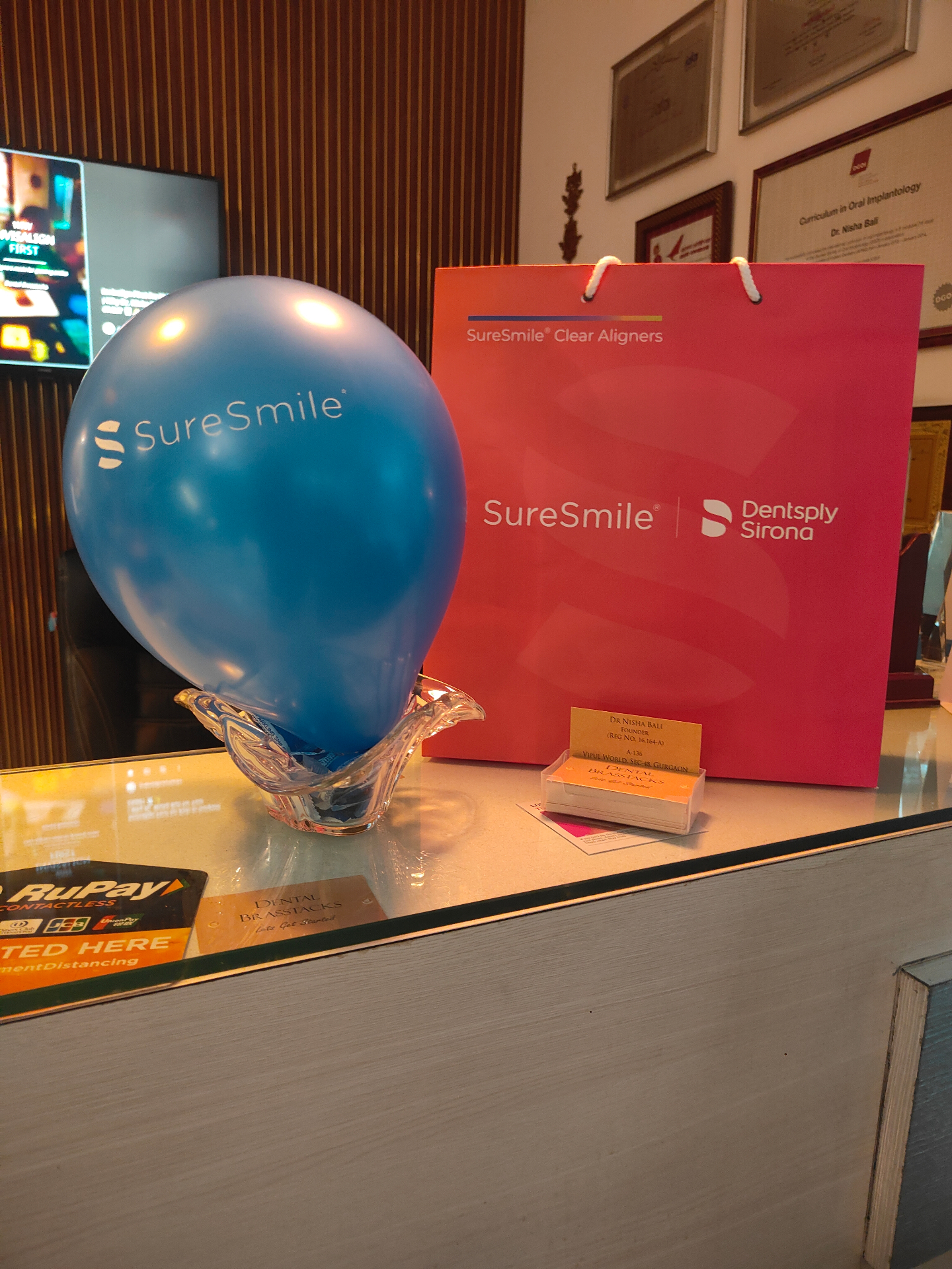 SureSmile aligner welcome kit displayed at Dental Brasstacks reception
