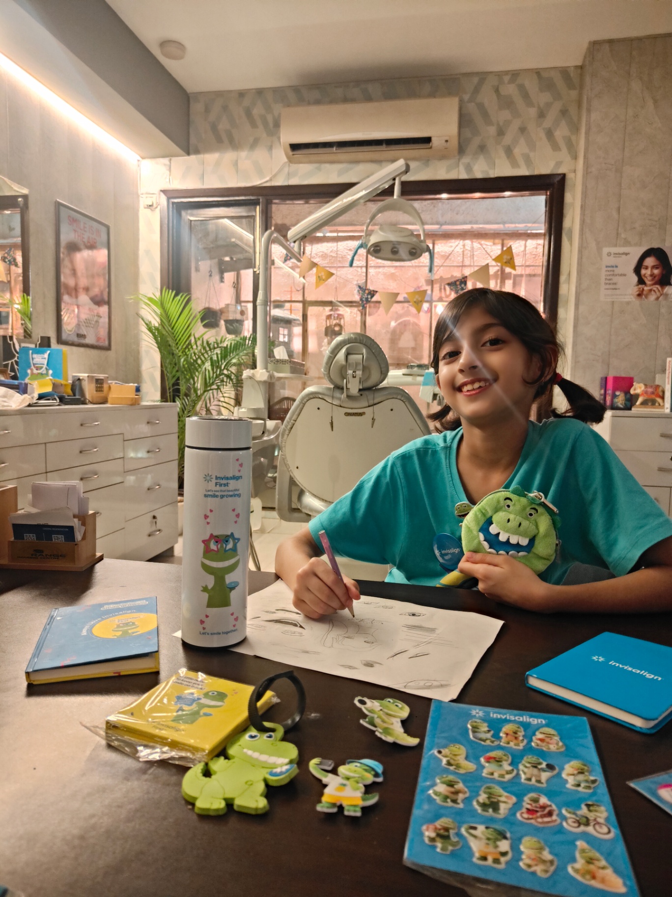 Child drawing with her Invisalign First kit