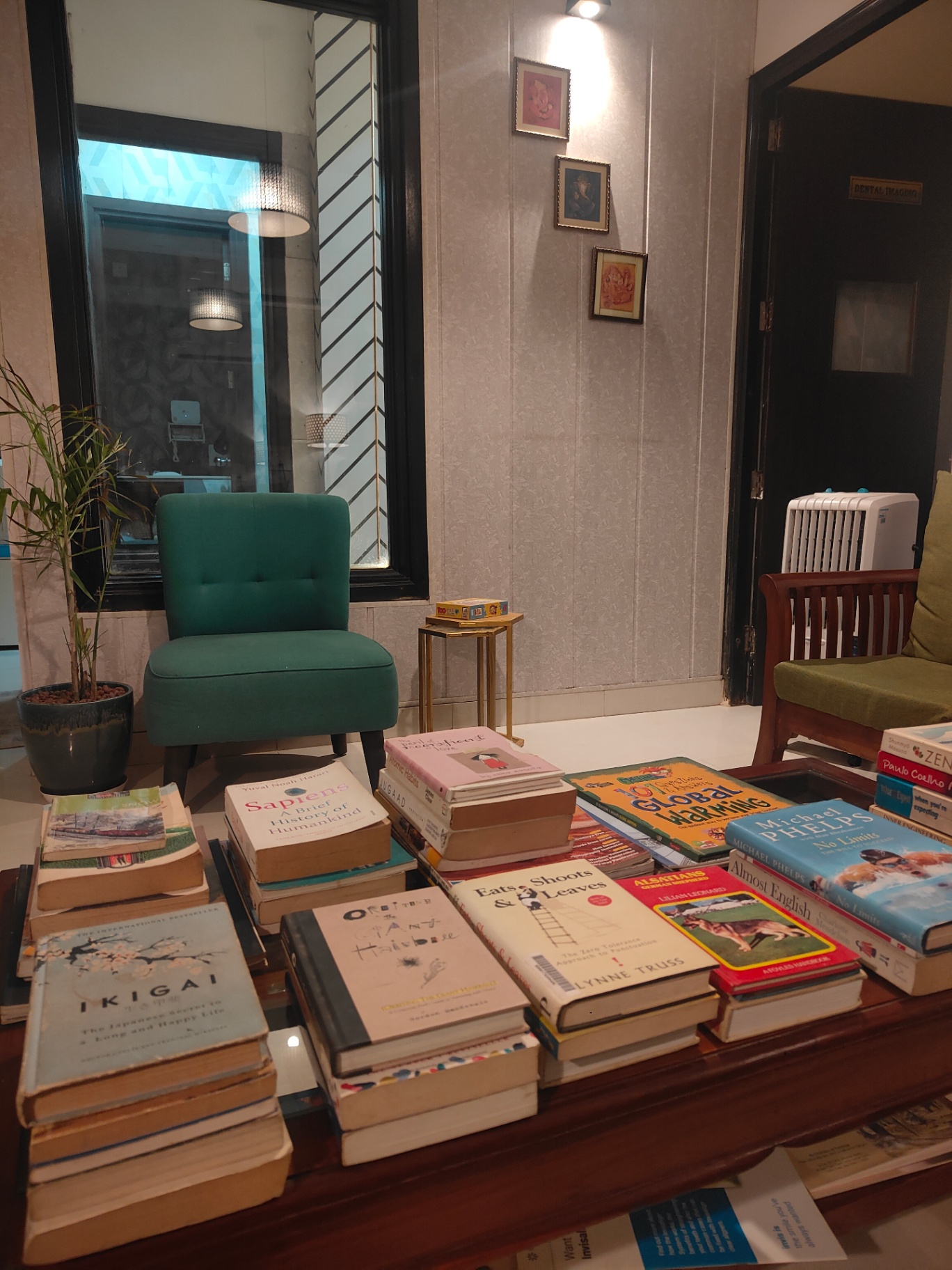 Books and a quiet reading chair in the Dental Brasstacks library designed and built by Dr. Nisha Bali