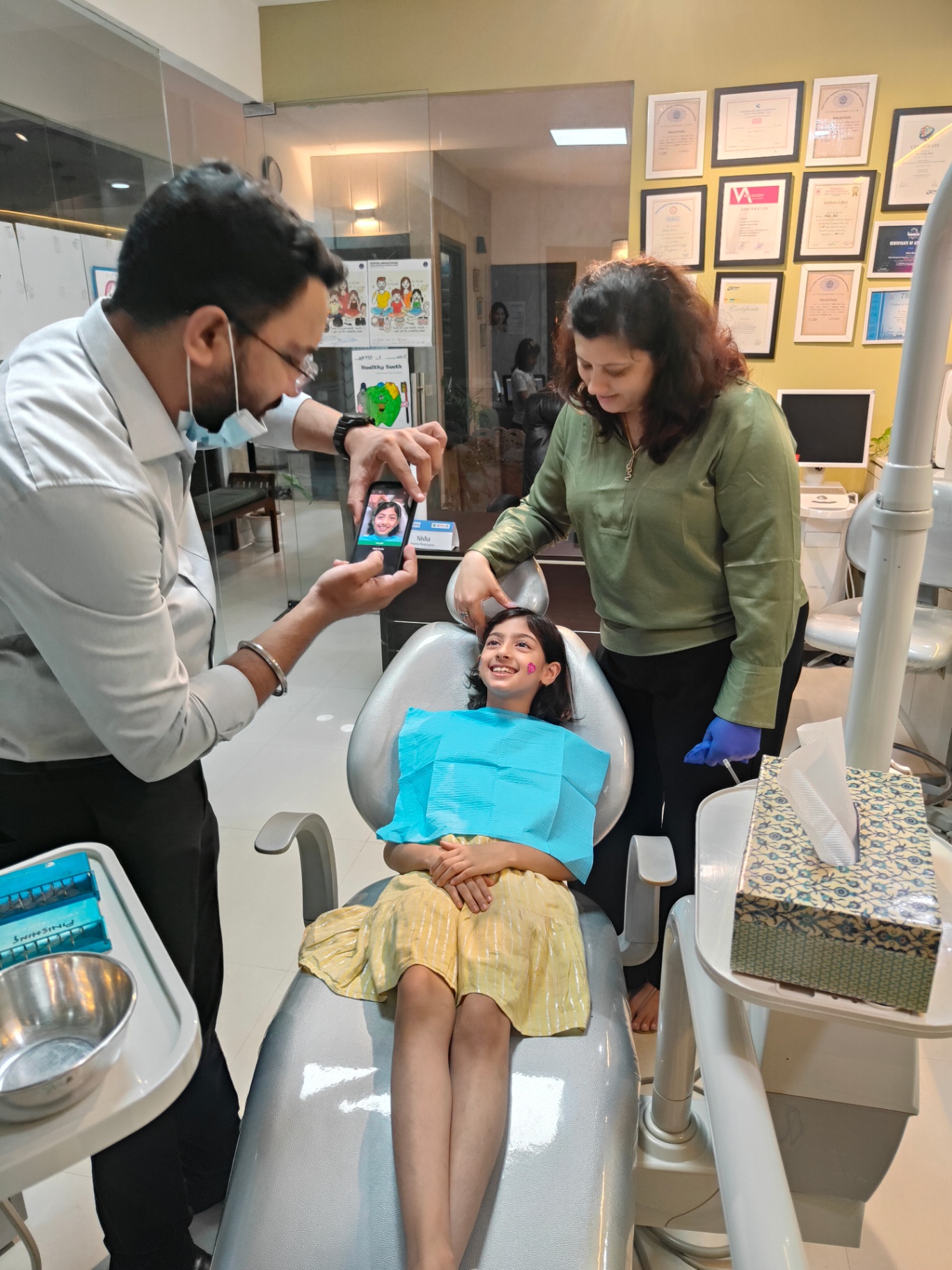 Chairside discussion with parent and child at Dental Brasstacks