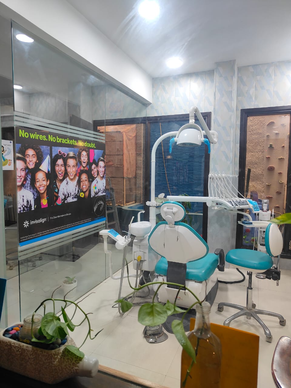 Invisalign operatory at Dental Brasstacks Gurgaon with dental chair and No wires No brackets No doubt poster