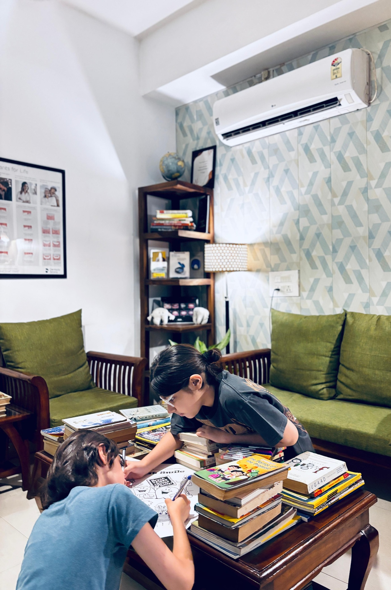 Children reading and colouring in the in-house library reading corner at Dental Brasstacks Gurgaon
